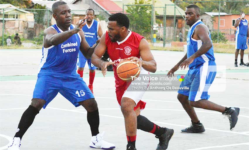 Image: Highlights from the game between Police and Dennery Dolphins on Saturday on the Vieux Fort Court.  (Photo: Anthony De Beauville) 