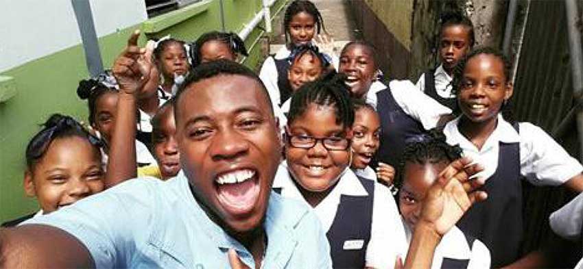 Image of Embert Ricardo Placide with some members of his choir.