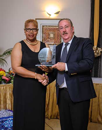 Image: Gabriel receiving her award for Manager of the Year