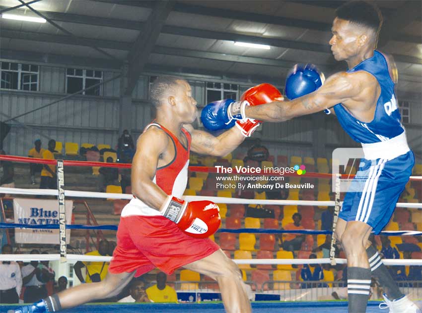 Image: Barbados’ Jabali Breedy (in red) against Jamesy Greenaway of Dominica. (PHOTO: Anthony De Beauville)