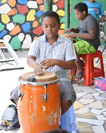 Image of boys learning drum skills.