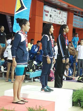 Image of Saint Lucia’s Katie Kyle receiving her bronze medal; Kyle, third from left. (Photo: TSLU)