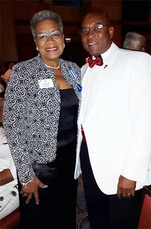Image: Lion District Governor Sherwin Greenidge and International Director Nicolyn Moore.
