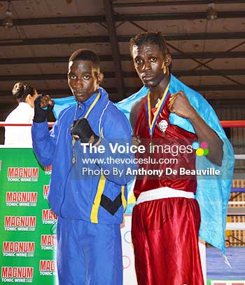 Image: Saint Lucia’s gold medal winners Nathan Ferrari and Lyndell Marcellin draped with the national flag. (Photo: Anthony De Beauville)