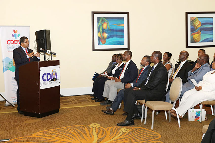 Image of Turnquest delivering keynote address at the launch of CDM10.