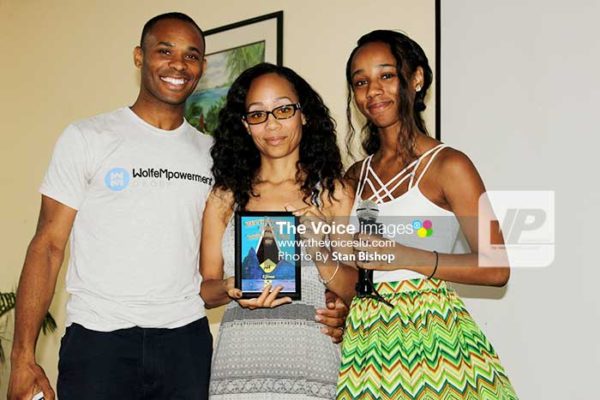 Image of Fifteen-year-old filmmaker Aniya Wolfe, (centre), and her parents.