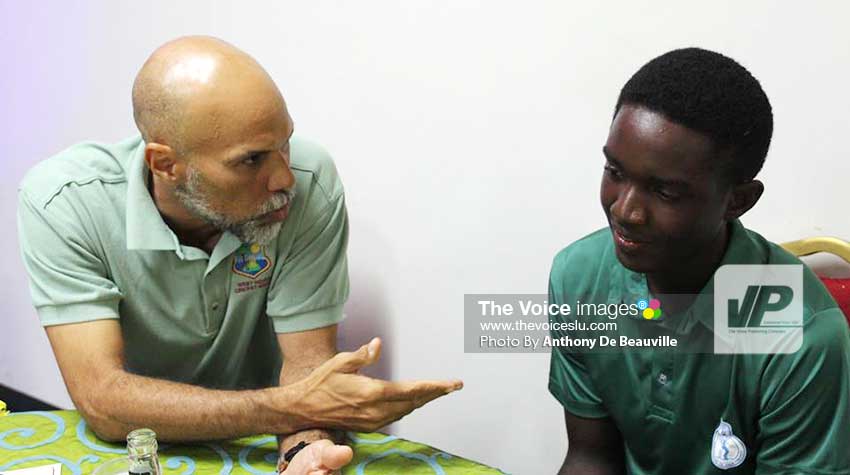 Image: Former West Indies captain, now Director of Cricket, Jimmy Adams shares a special moment with Kimani Melius. ( Photo: Anthony De Beauville/WICB)