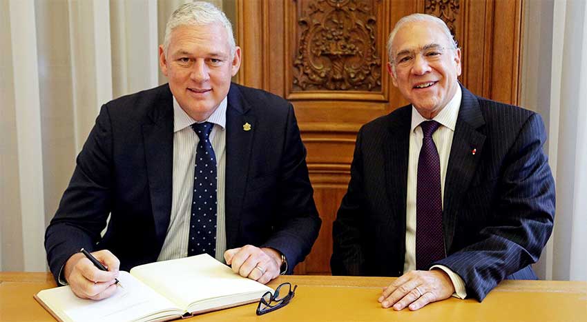 Image: Prime Minister Allen Chastanet with OECD Secretary General, Angel Gurria.
