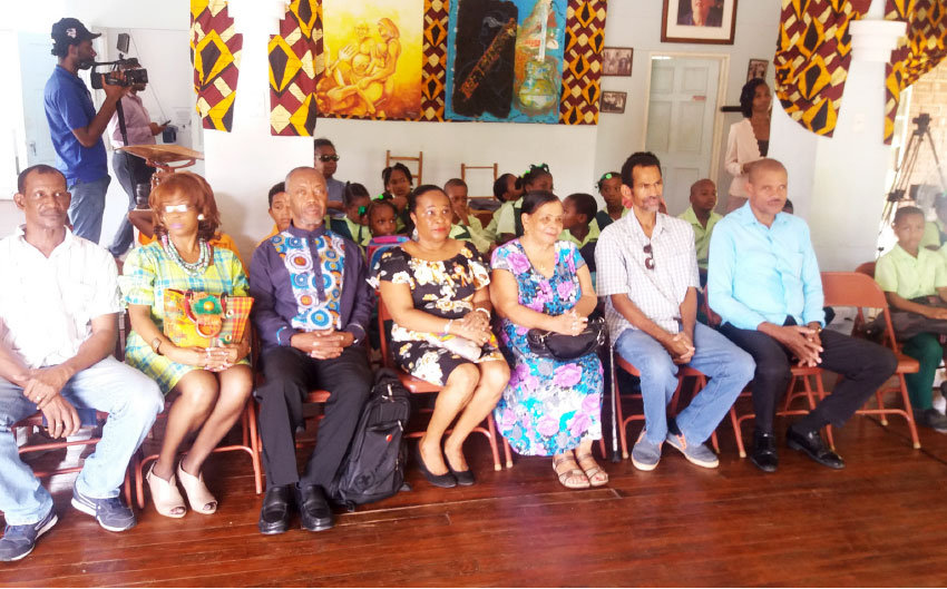 Image of The St. Omer Family alongside PABA, Teachers and Students