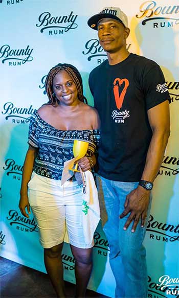 Image of Bounty Rum Brand Manager Tony Polius with one of the winners at the Bounty launch.