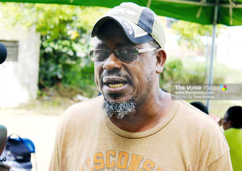Image: Patrick Altius, brought in his dog, Pony, which was once a stray, to undergo the procedure. [PHOTO: Stan Bishop]