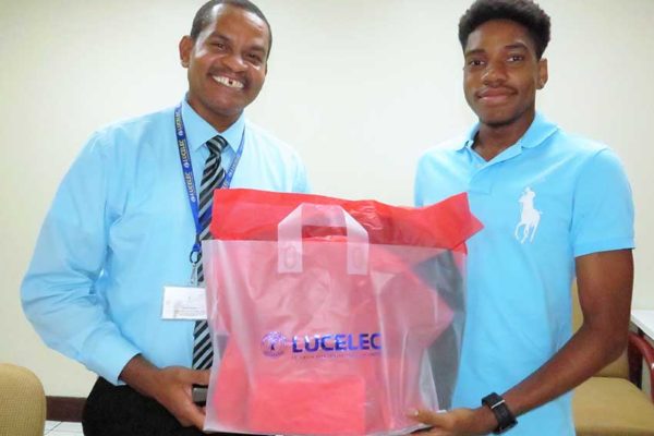 Image:“The LUCELEC sponsored 2017 SPISE student receives a token from LUCELEC Corporate Communications Manager Mr Roger Joseph”