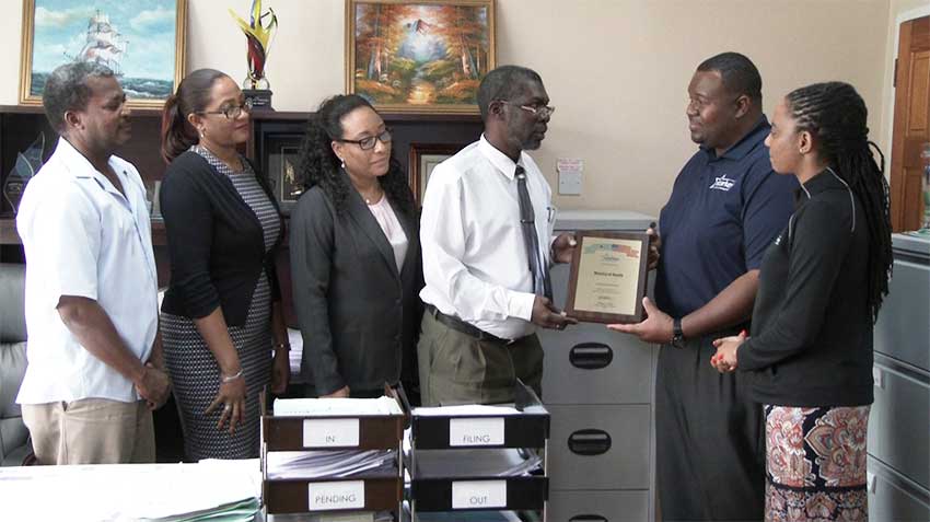 Image: Starkey officials, right, meeting with local officials.