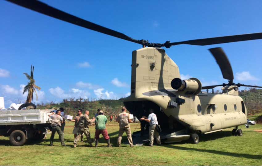 Image: The United States Government team members offload supplies in Dominica.