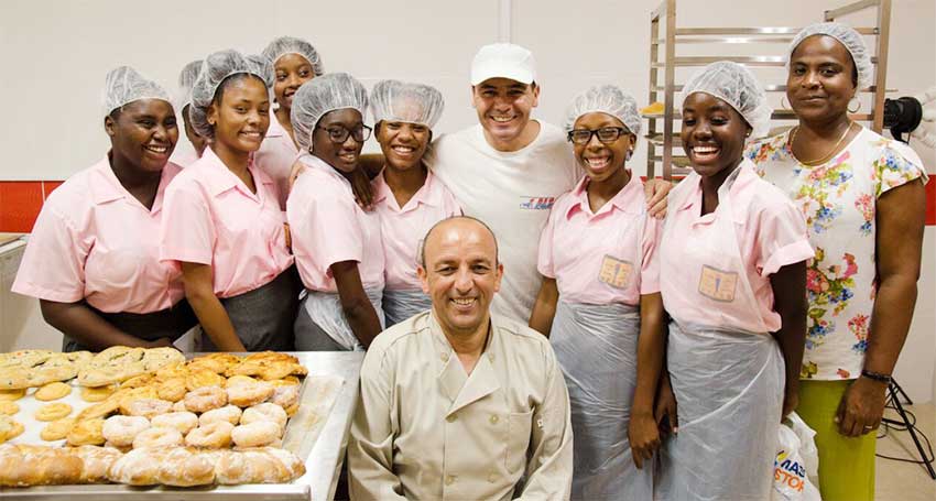 Image: Bakers Michael and Ali with students from Vieux Fort Comprehensive Secondary School.