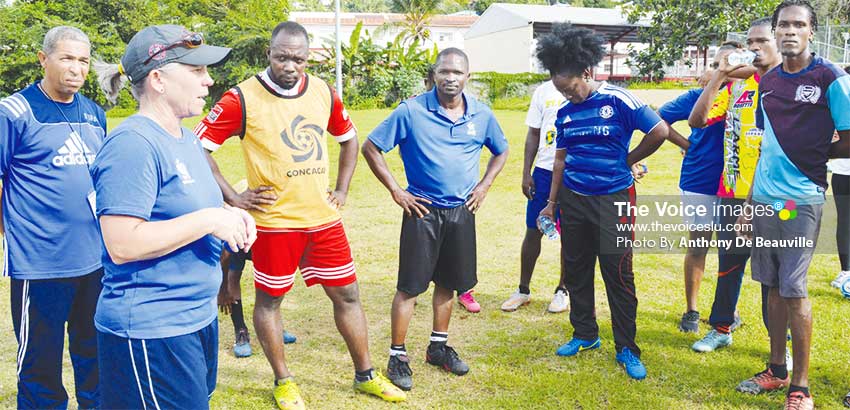 Image: CONCACAF facilitator Stephanie Gabbert (second from left) speaking to the coaches during a Tactical Training ll exercise.(PHOTO: Anthony De Beauville)