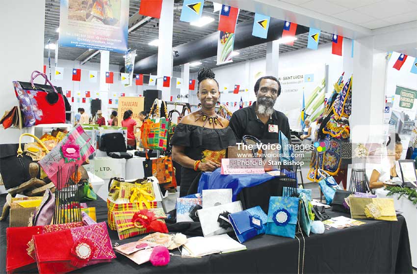 Image: Christine Samuel and hubby, Kennedy, at their colourful booth. [PHOTO: Stan Bishop]
