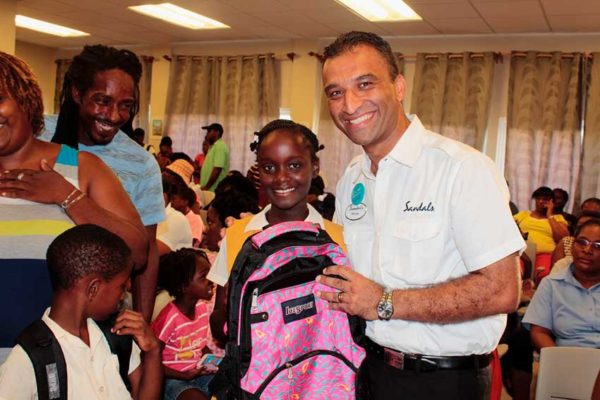 Image: Sandals Grande Antigua General Manager, Gaurav “G” Sindhi, made a personal commitment to ensure that each child present received supplies.