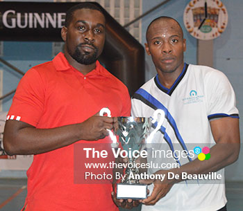 Image of Marketing Manager of KFC Jamal Cyril presenting the second place trophy to Windjammer captain Tyson Fedee. (Photo: Anthony De Beauville)