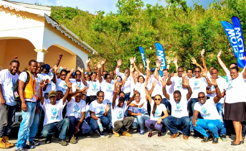 Image: Mission Accomplished! C&W CEO John Reid celebrates with members of his executive team and the colleagues of Flow Dominica on the completion of their Mission Day 2017 Volunteer activity in Dominica at CHANCES.
