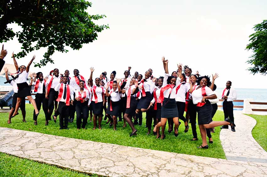 Image: The most recent Sandals HTP graduates jump for joy on their graduation day.