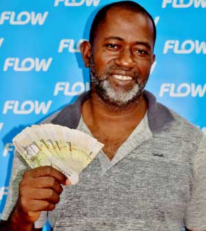 Image of SALCC farm manager Lench Fevrier from Mon Repos, Micoud, a proud Flow customer and a $2000 cash winner!