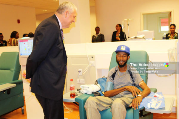 Image of PM Chastanet chatting with a patient on dialysis during a tour of the facility on Wednesday. (PHOTO:PhotoMike).