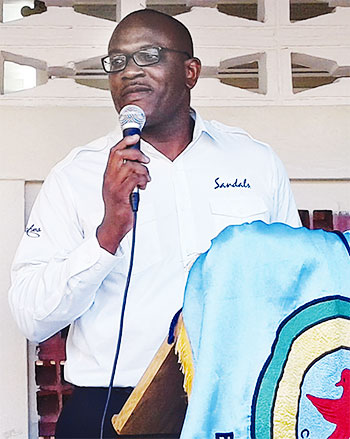 Image of Ryan Matthew addressing students at the Entrepot Secondary School.