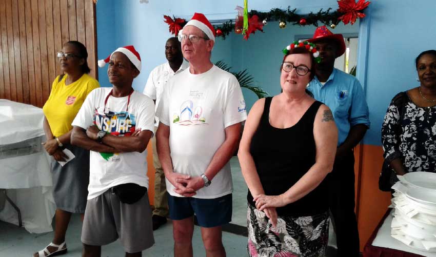 Image: Sandals guests Gordon and Elizabeth Craig join in the Christmas spirit and assist at the Boxing Day lunch.