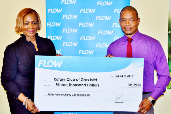 Image: Flow Communications Specialist, Terry Finisterre, presents the sponsorship cheque for the 2018 Golf Tournament to Rotary Club of Gros Islet president, Angela Clarke.