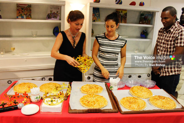 Image: Two Alliance Francaise staffers, left, share the Gallet de Rois. [PHOTO: Stan Bishop]