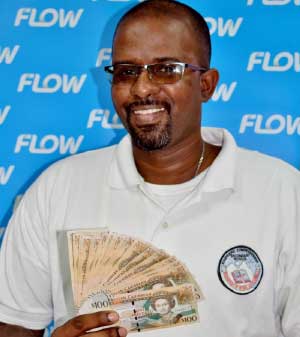 Image of Soufriere Comprehensive mathematics teacher Zial Williams will be counting up his $2000 winnings from Flow!