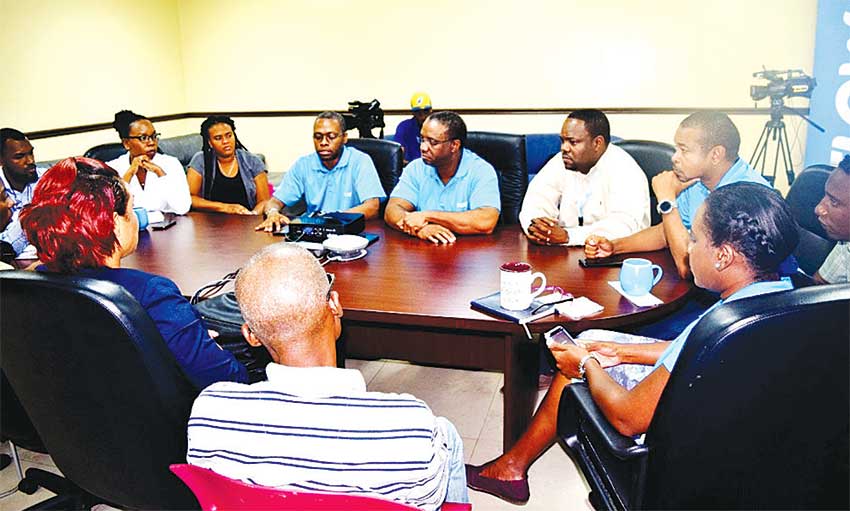 Image: Flow officials and members of the media at the recent breakfast meeting.