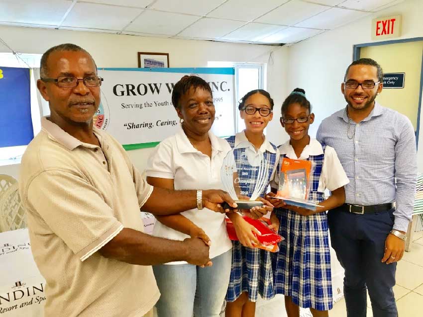 Image: Grow Well President Paul Lorde, left, presents trophy to Montessori Centre winners and teachers.