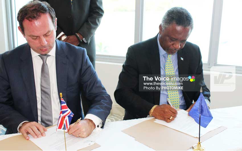 Image: Resident British Commissioner Steve Cready and Home Affairs and National Security Minister Hermangild Francis signing MOU yesterday. [ PHOTO: PHOTOMIKE]
