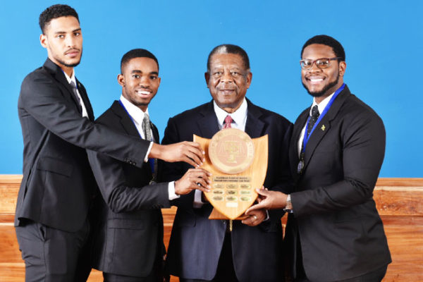 Image: The winning Norman Manley team and the CCJ President.