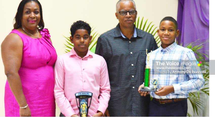 Image: (L-R) Deputy PS Department of Youth Development and Sports – Liota Charlemagne – Mason, Ethan Hazell 2nd place male swimmer of the year; SLASA President – Eddie Hazell and Karic Charles 1st place male swimmer of the year. (PHOTO: Anthony De Beauville)