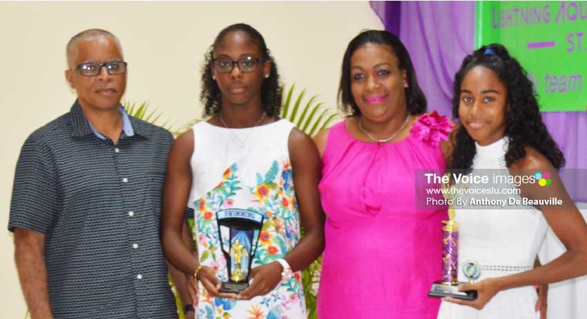 Image: (L-R) SLASA President Eddie Hazel, Naekeisha Louis 2nd place female swimmer of the year, Deputy PS Sports – Liota Charlemagne- Mason, and Naima Hazell 1st place female swimmer of the year. (PHOTO: Anthony De Beauville)