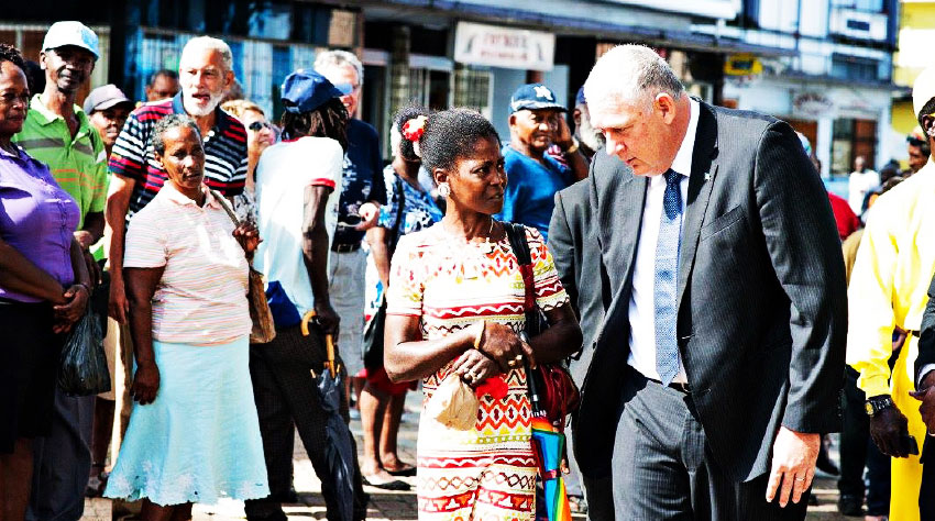Image: The PM meets members of the public outside parliament before delivering his 2018-2019 budget.