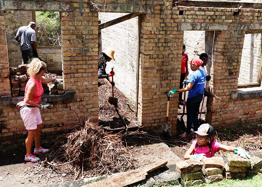 Image: Women and children participating in clean-up