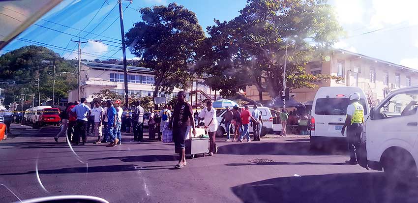 Image: Hoards of curious onlookers after Bullets ripped through the busy Castries City