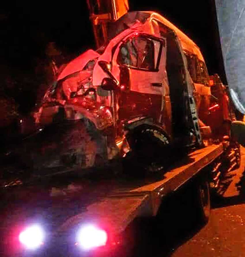 Image of Badly Damaged bus about to be towed