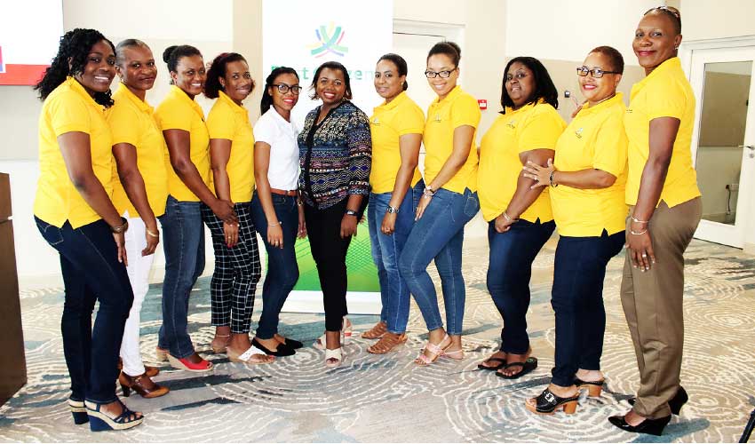 Image of Ladies from 1st National Bank in attendance at the seminar with the Country Manager of FCIS