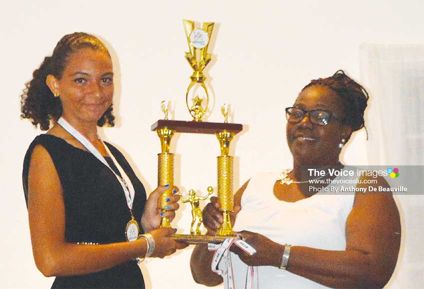 Image: Female basketball captain Matilda Angeloni receiving the second place trophy from Director of Youth, Mary Wilfred. (PHOTO: Anthony De Beauville)