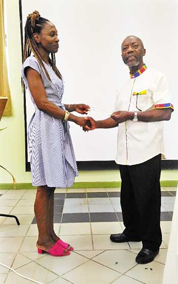 Image of Monsignor Anthony and Miss Aoki.