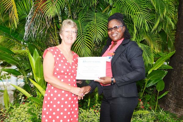 Image of Kenisha Jeffrey receiving scholarship
