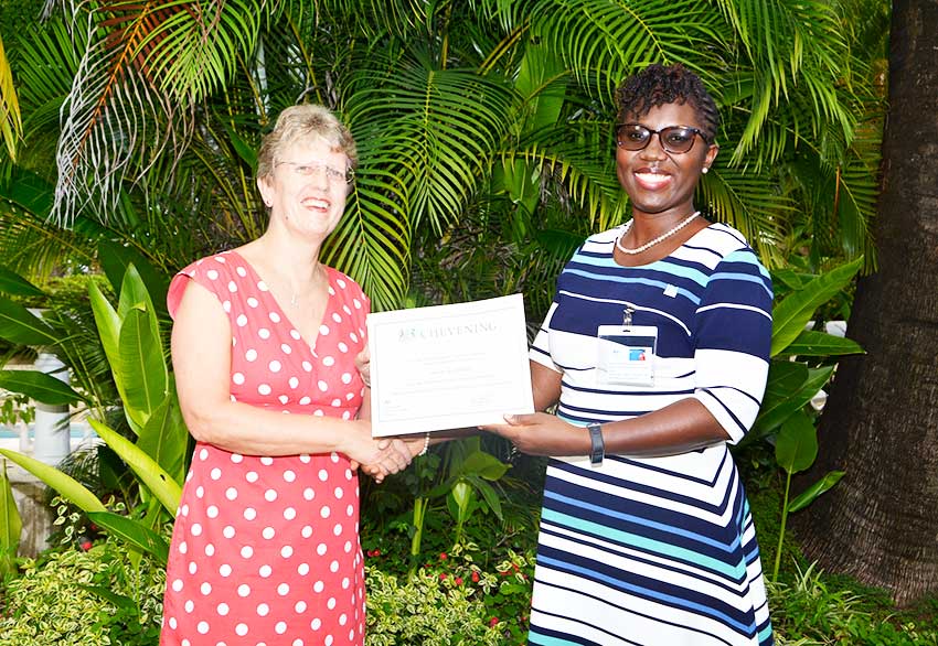 Image of Lavorne Verdant-Desir receiving scholarship