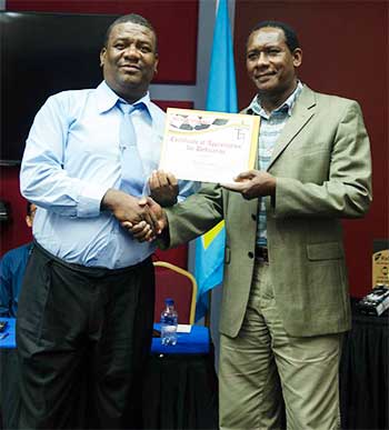 Image: Minister Montoute (left) attended the presentation ceremony.