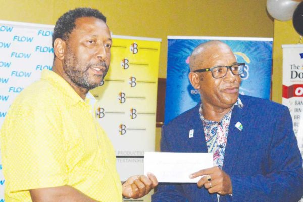 Image: President Lyndon Cooper receiving the $105, 400 cheque