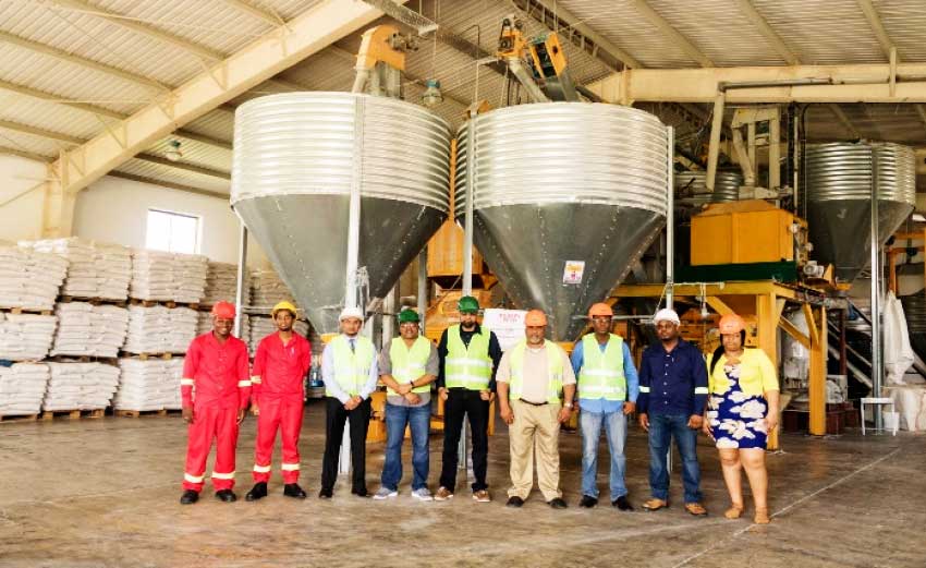 Image: Touring team inside the Caribbean Grains Feed Mill